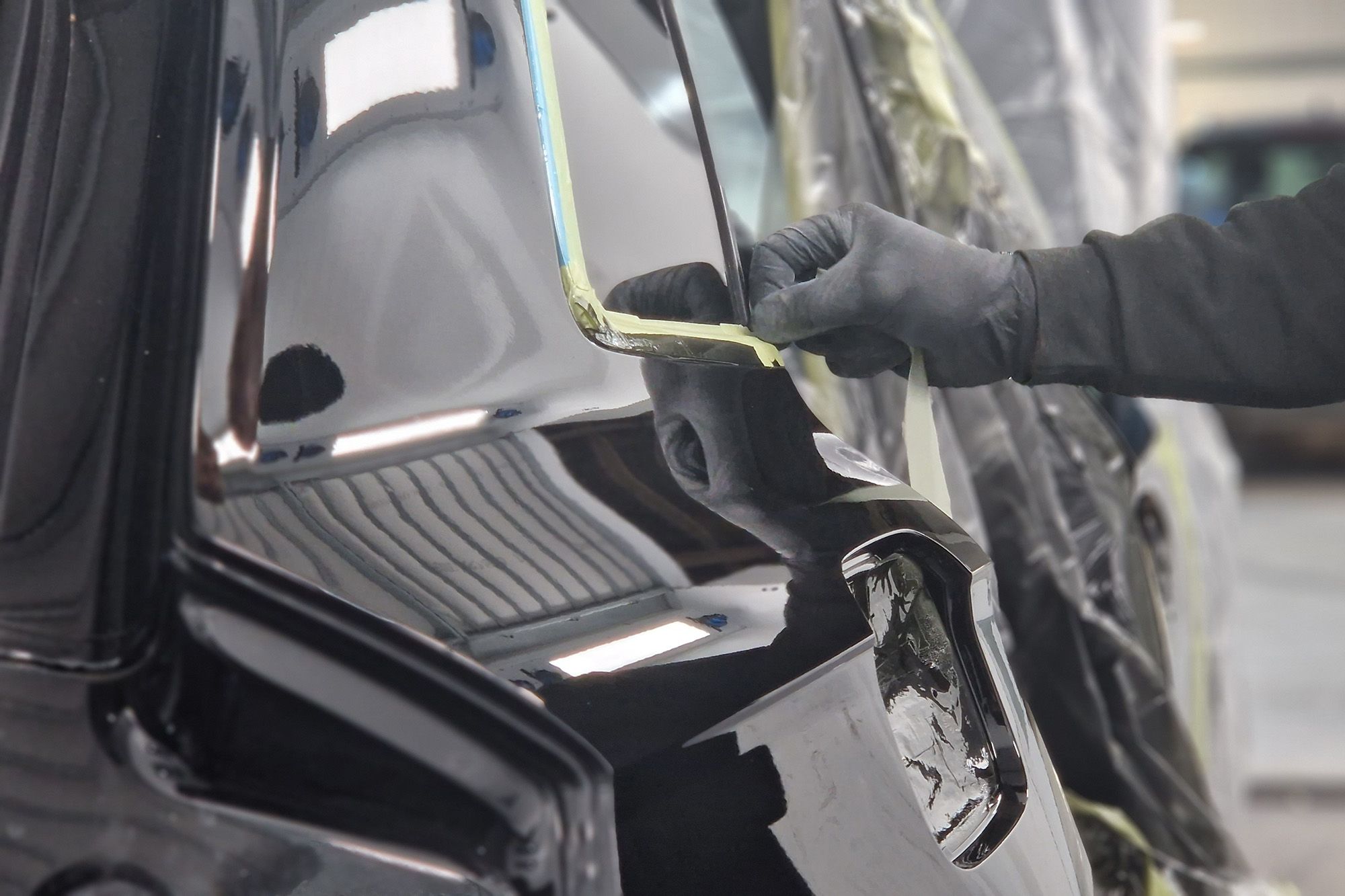 Removing masking tape from a freshly painted Land Rover