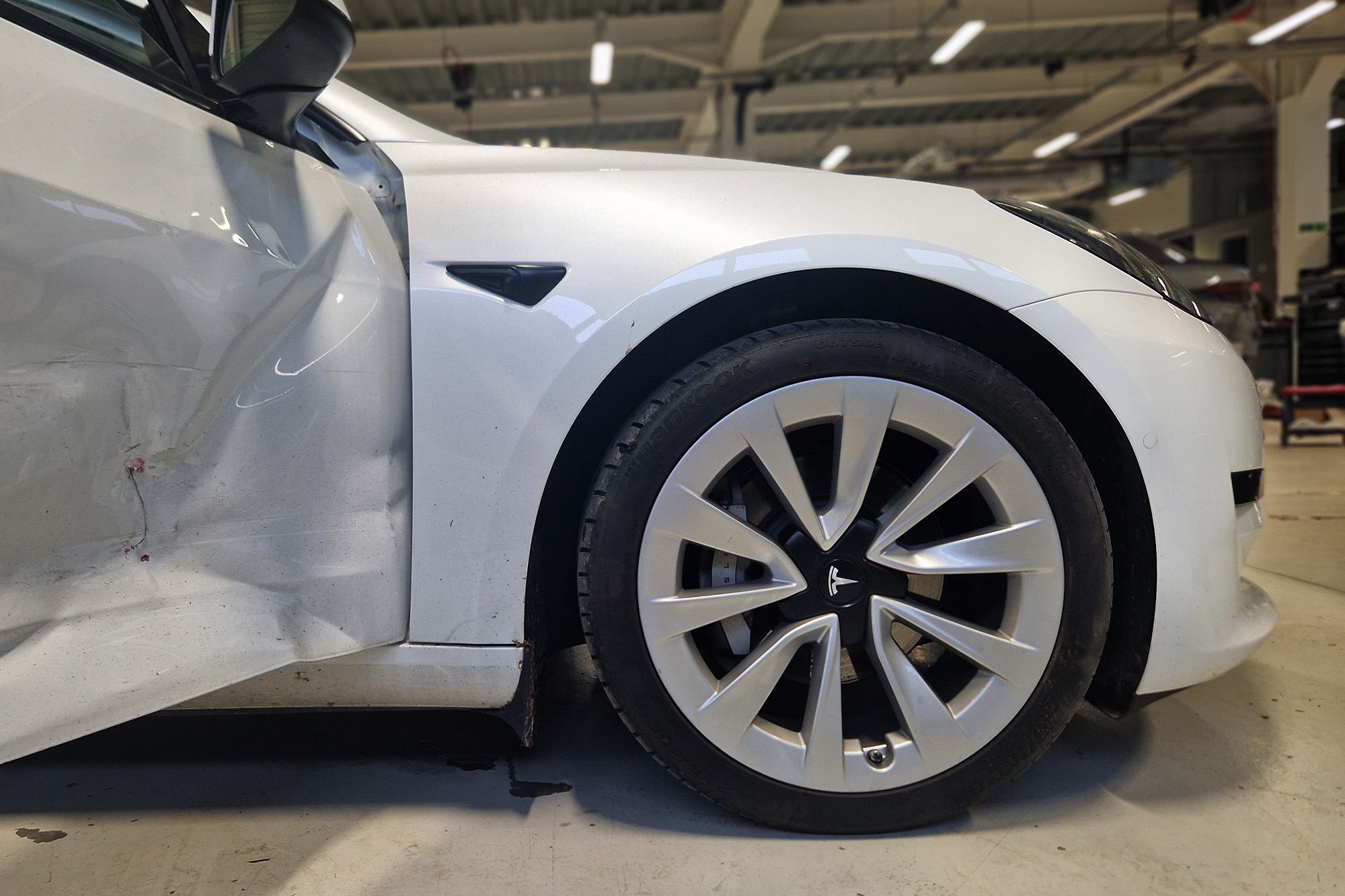 Tesla front wheel and door repair